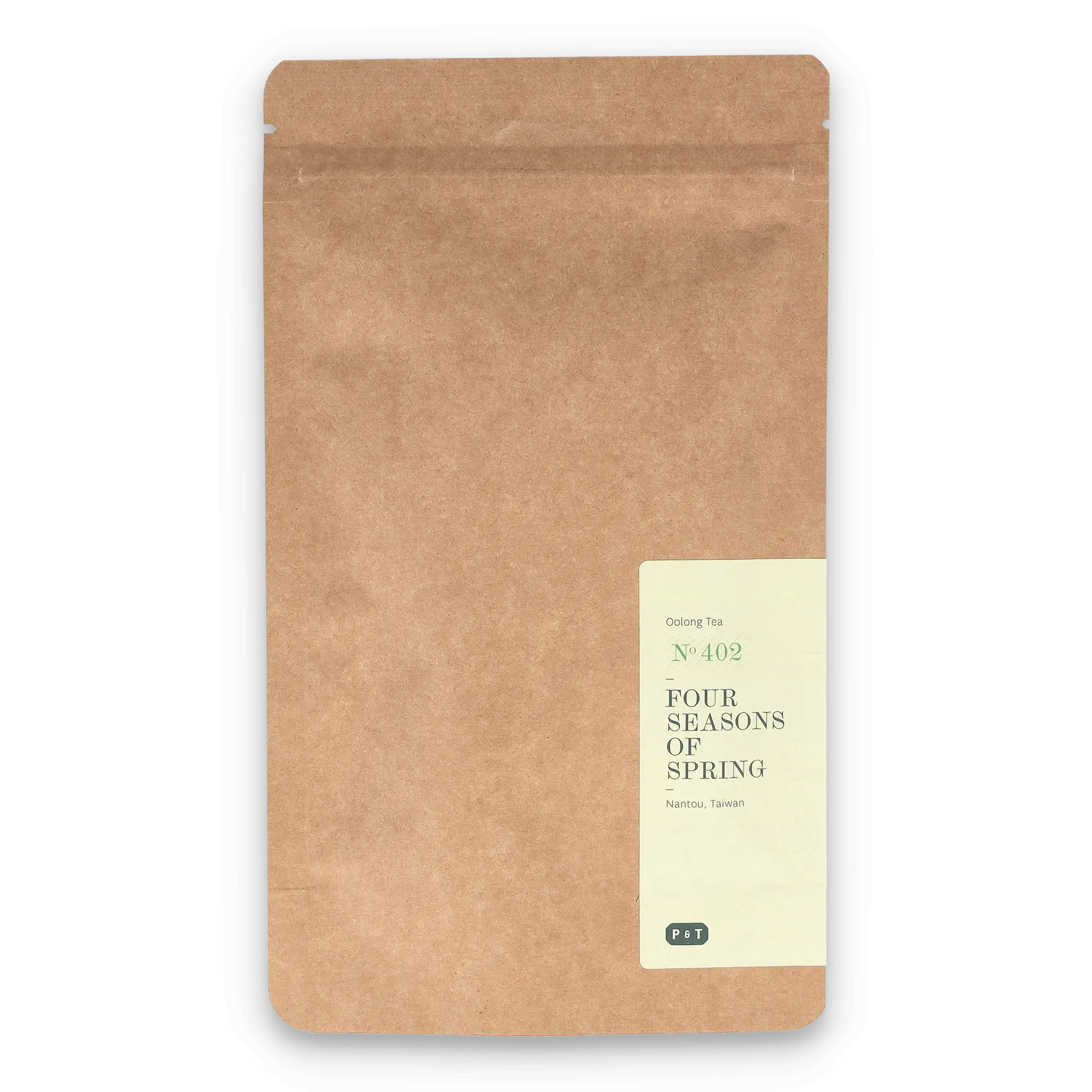 Teeverpackung aus braunem Kraftpapier mit schwarzem Rand und weißem Etikett, Aufschrift 'Oolong Tea N°402'.