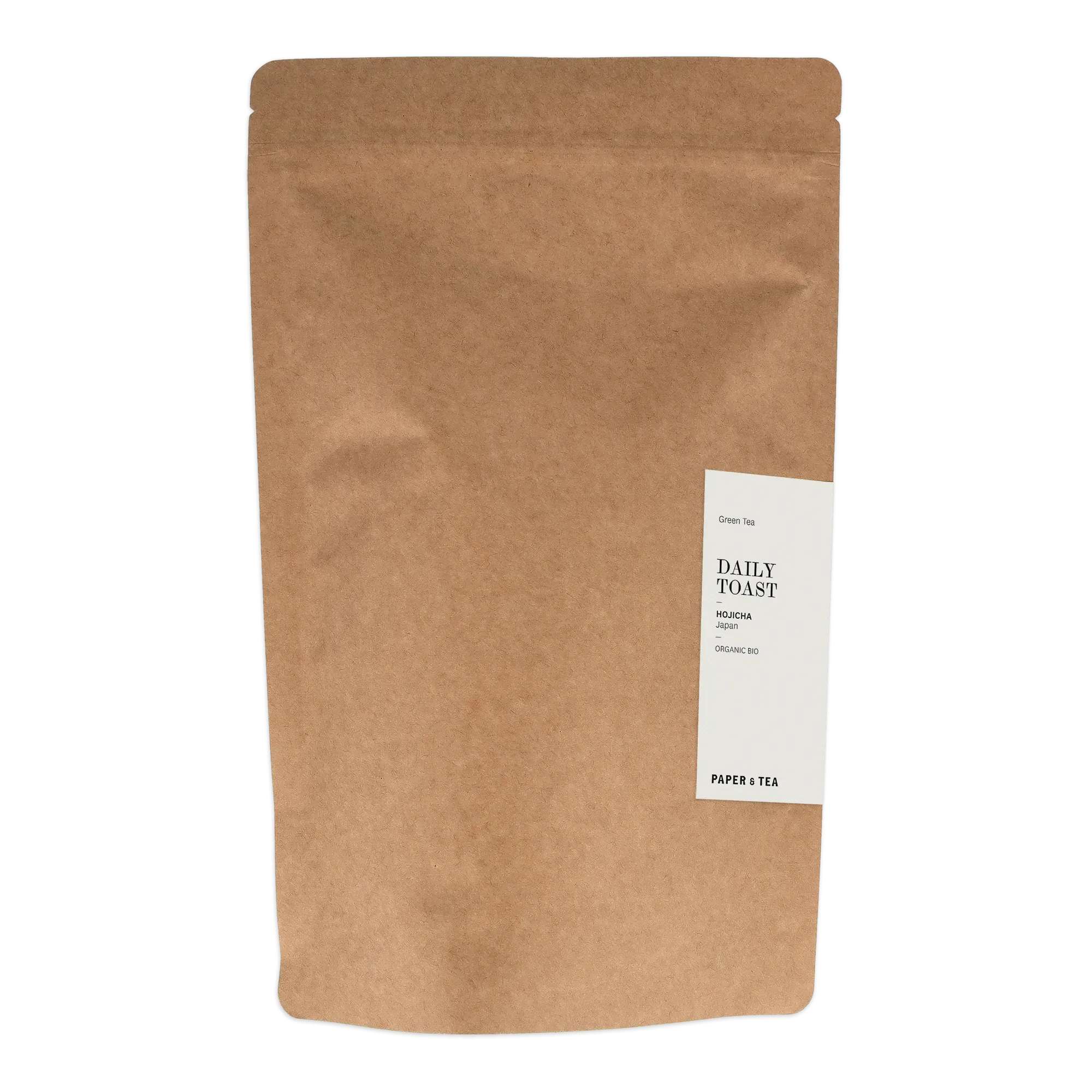 Braune Kraftpapierverpackung mit Zipper und Etikett für Organic Bio Hojicha Grüntee von Paper & Tea.